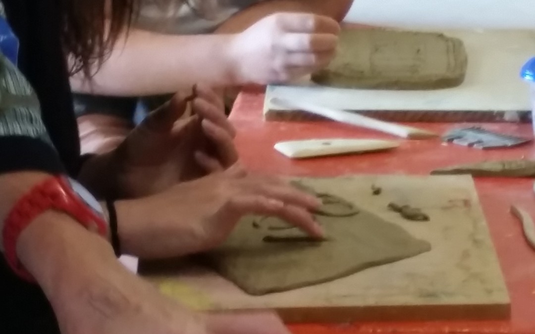 Hineora students making clay labels for harakeke (flax)